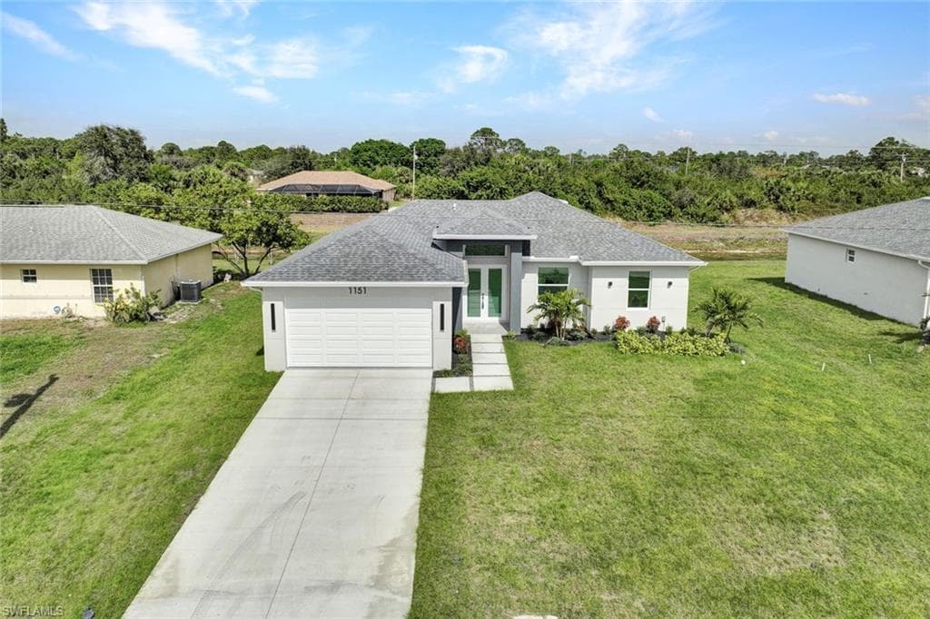 1153 Ermine St E, Lehigh Acres, FL 33974-1