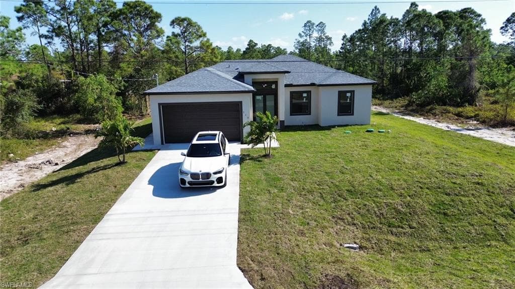 719 Fullerton Ave S, Lehigh Acres, FL 33974-3
