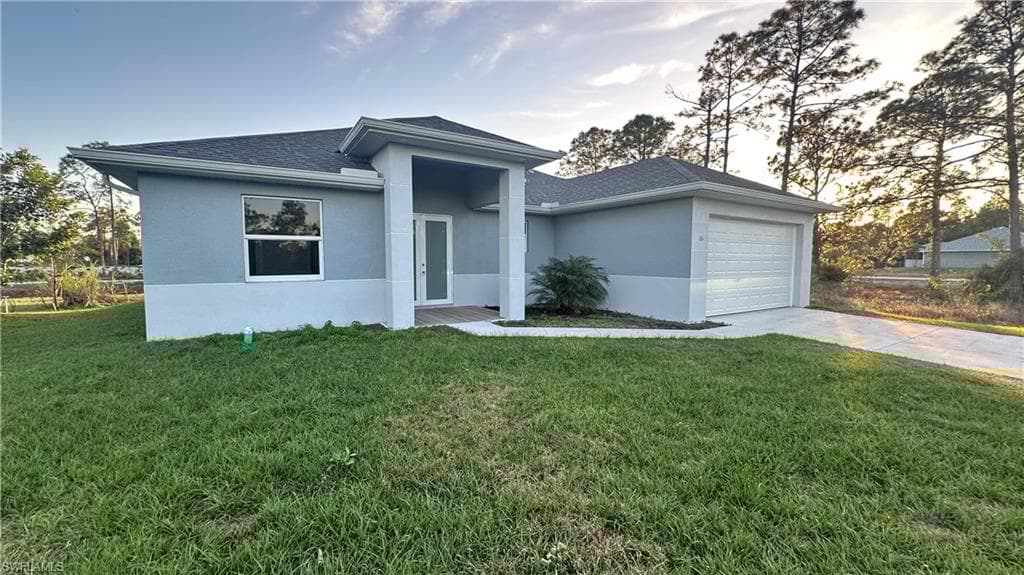 606 Ames St E, Lehigh Acres, FL 33974-4