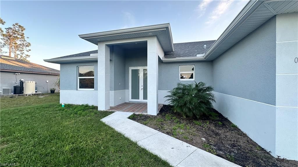 606 Ames St E, Lehigh Acres, FL 33974-5