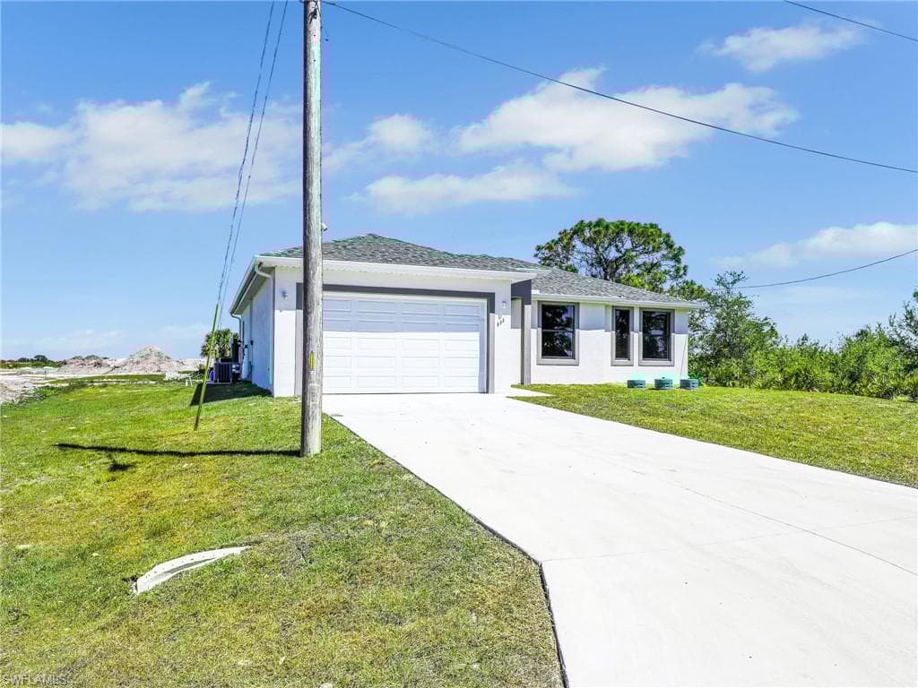 633 Cane St E, Lehigh Acres, FL 33974-3