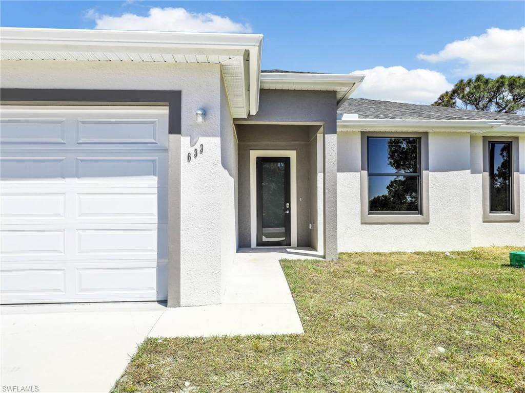 633 Cane St E, Lehigh Acres, FL 33974-5