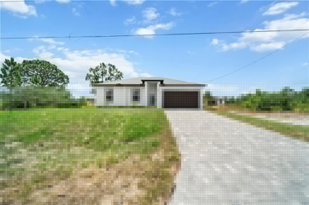 740 Newhall St E, Lehigh Acres, FL 33974-3