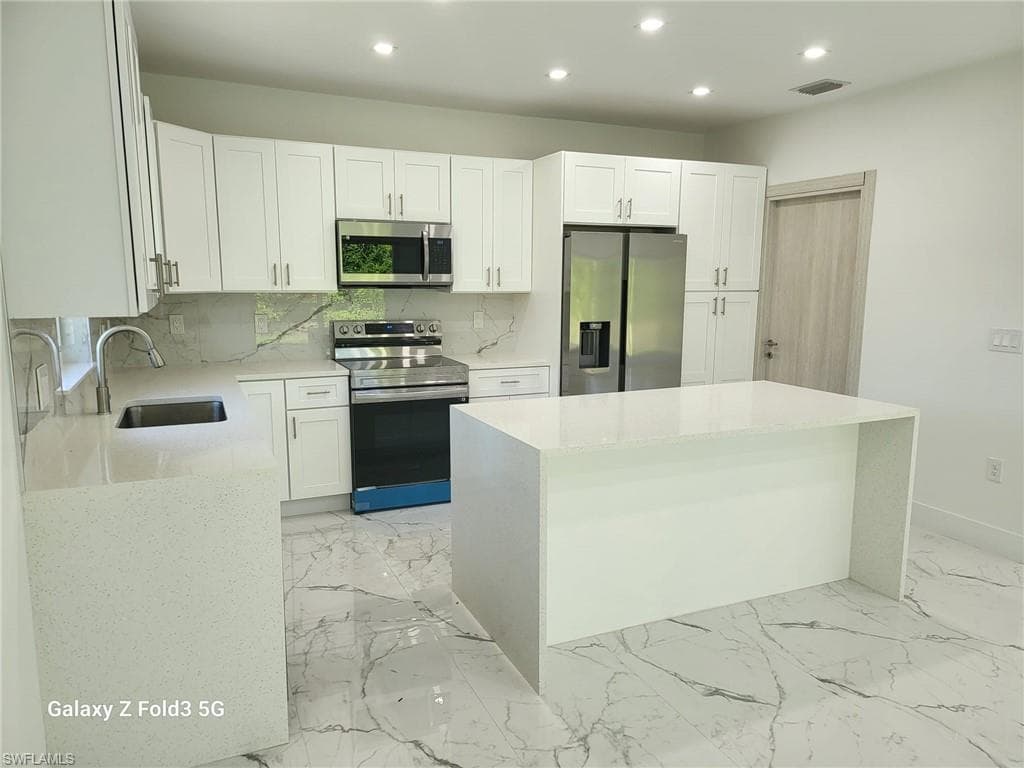 521 Frank Jewett Ave S, Lehigh Acres, FL 33974-5