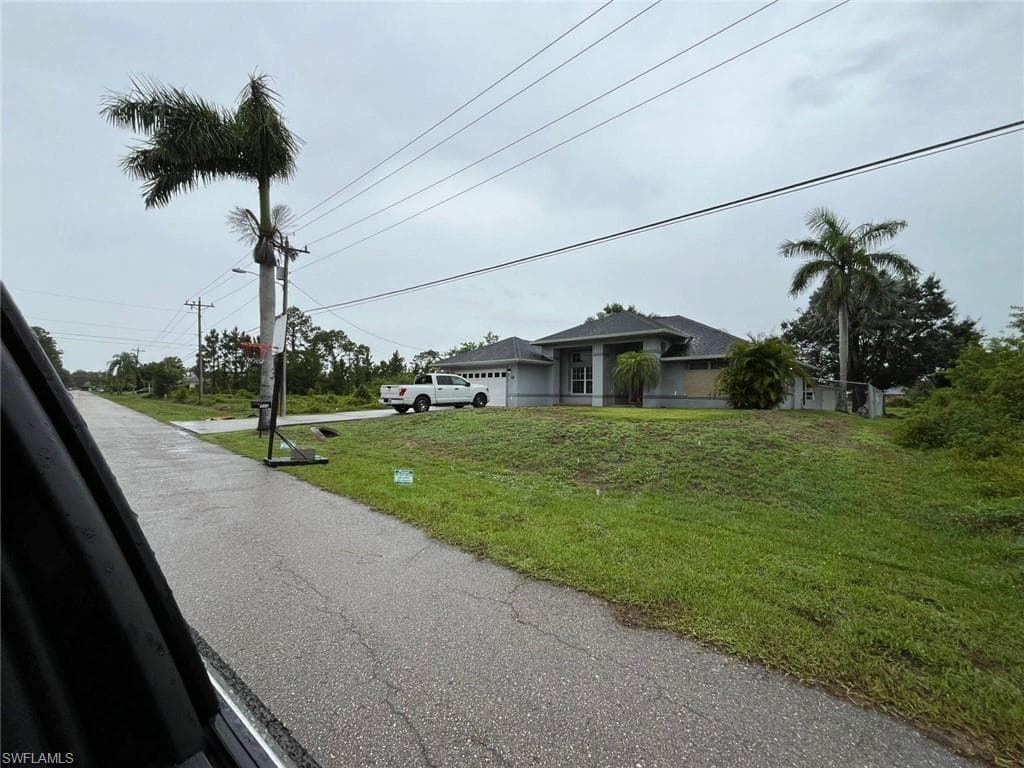 731 Bently St E, Lehigh Acres, FL 33974-4