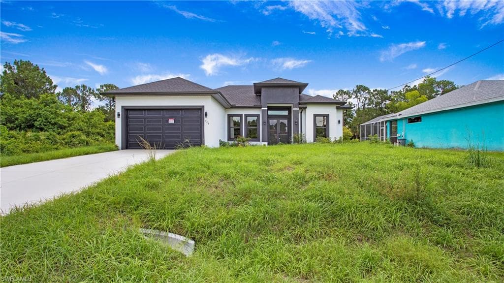739 David Laird Ln, Lehigh Acres, FL 33974-2
