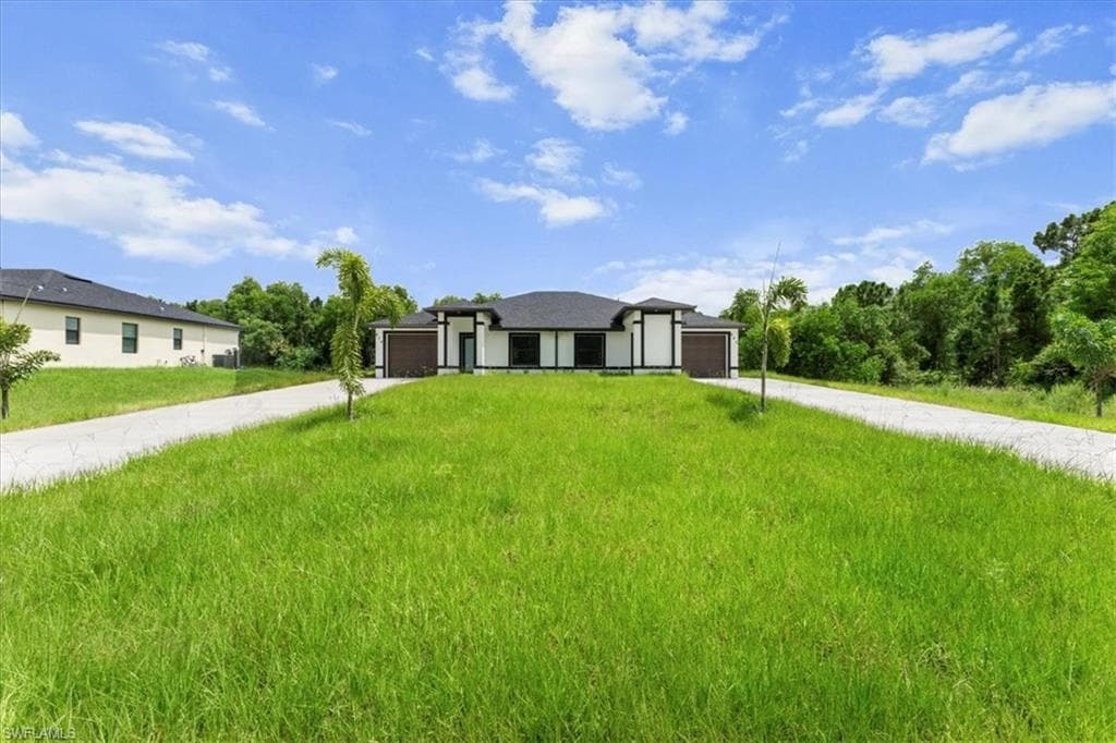 668/670 Chemstrand St E, Lehigh Acres, FL 33974-3
