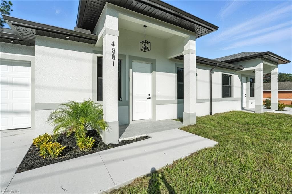 4881/4883 Leonard Blvd S, Lehigh Acres, FL 33973-3
