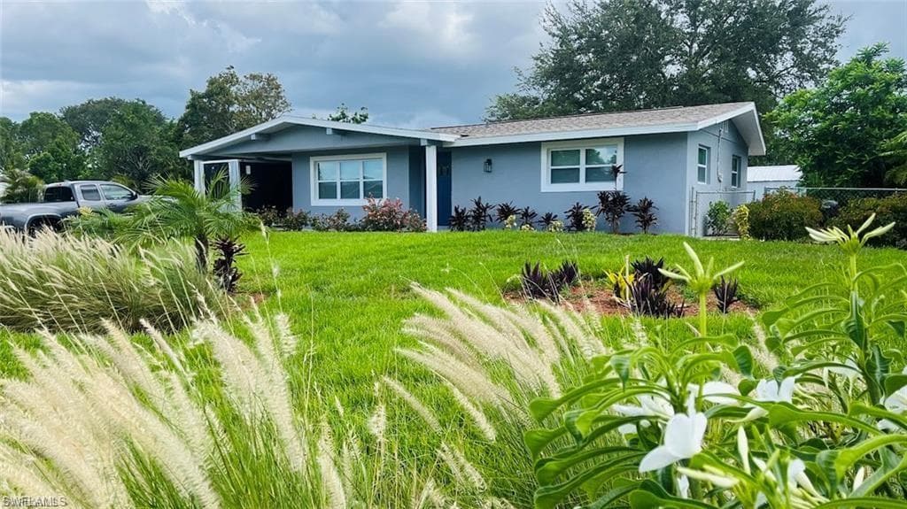 4 Palm Blvd, Lehigh Acres, FL 33936-1