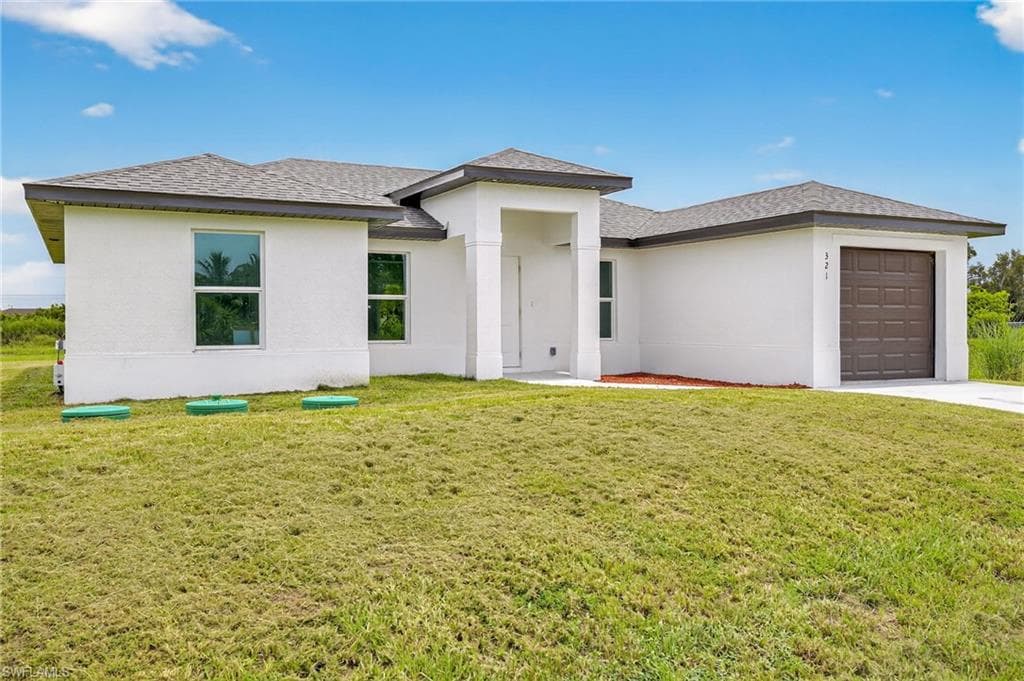 321 Ranier Ave, Lehigh Acres, FL 33974-4