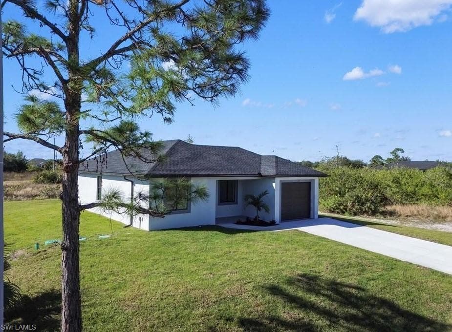 312 Progress Ave, Lehigh Acres, FL 33974-3
